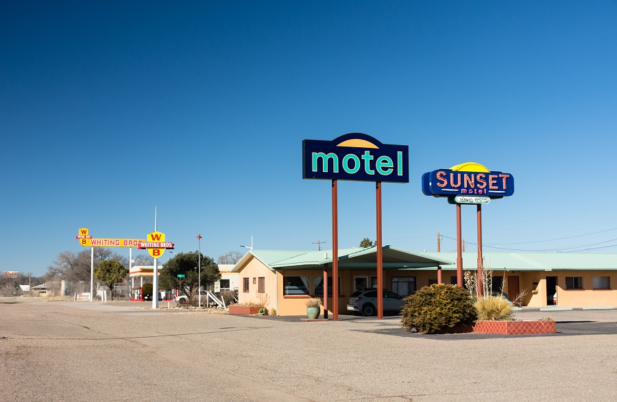 Moriarty, NM - USA: The Sunset Motel with Whiting Gas Station on historic Route 66. Sunshine, clear, blue sky.