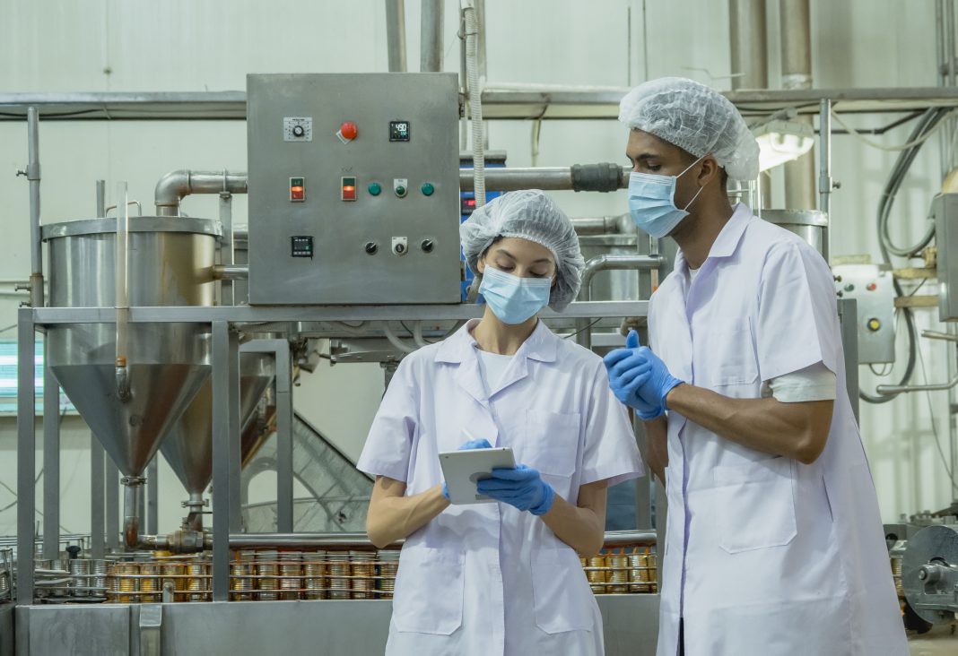 Health officials analyzing charts and data on sexually transmitted infection trends in New Mexico during a public health meeting.