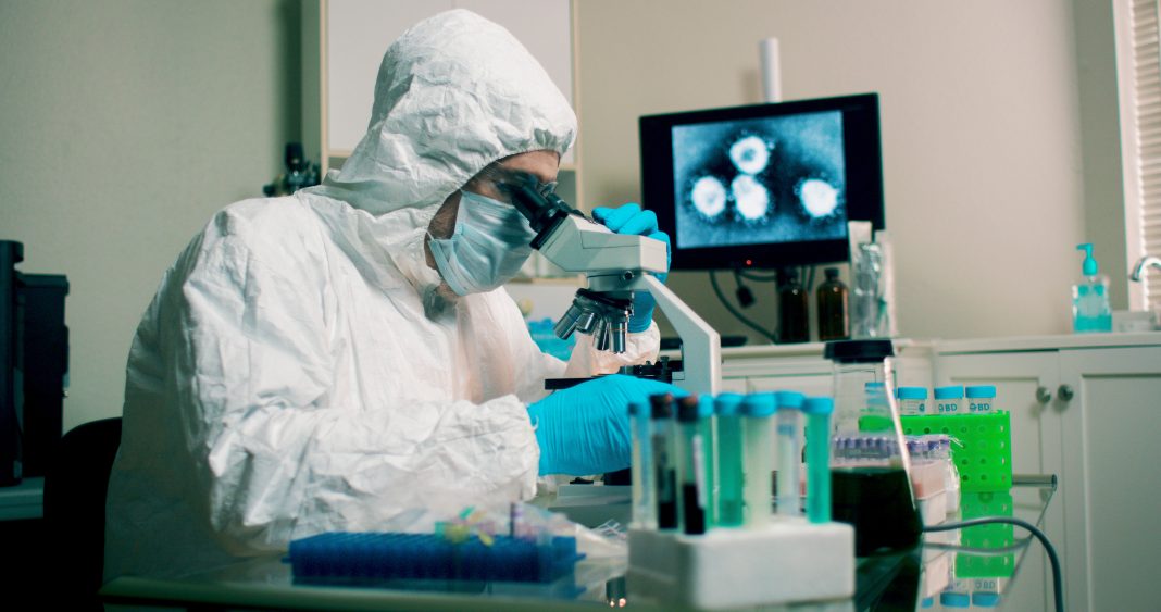 Scientists working in a laboratory at the Centers for Disease Control and Prevention studying infectious diseases and analyzing samples.