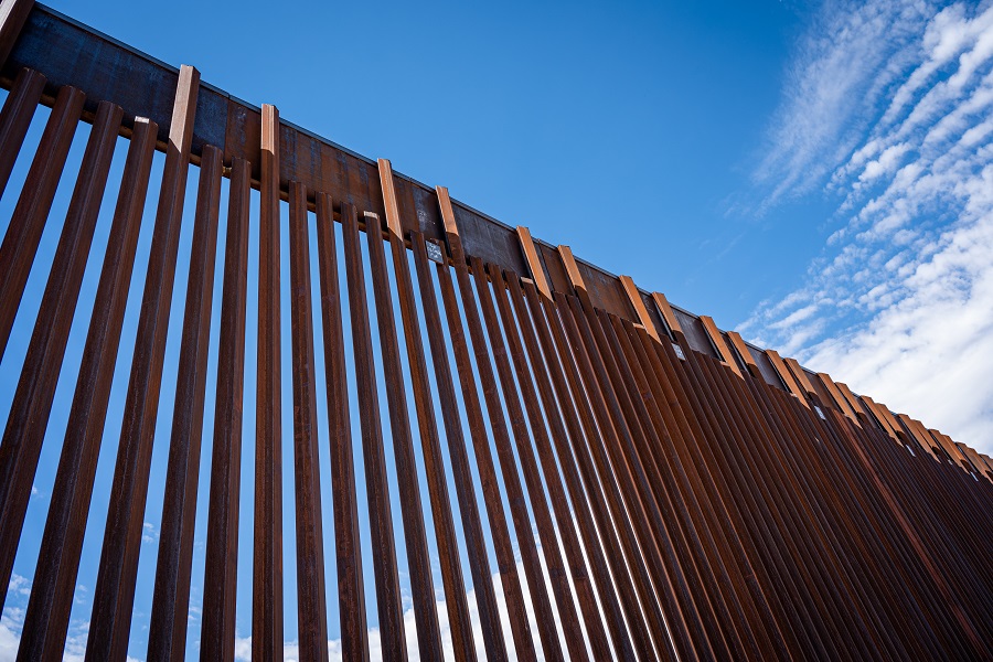 border wall and clouds