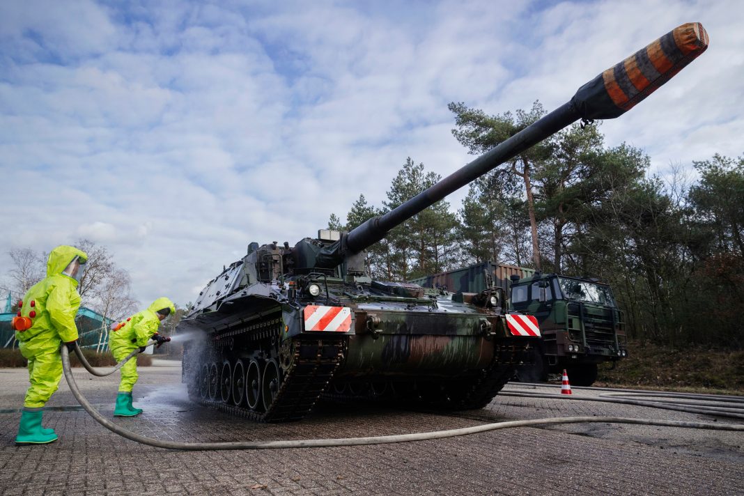 U.S. Air Force personnel clean equipment at Cannon Air Force Base, symbolizing efforts to remove PFAS contamination and protect surrounding communities.