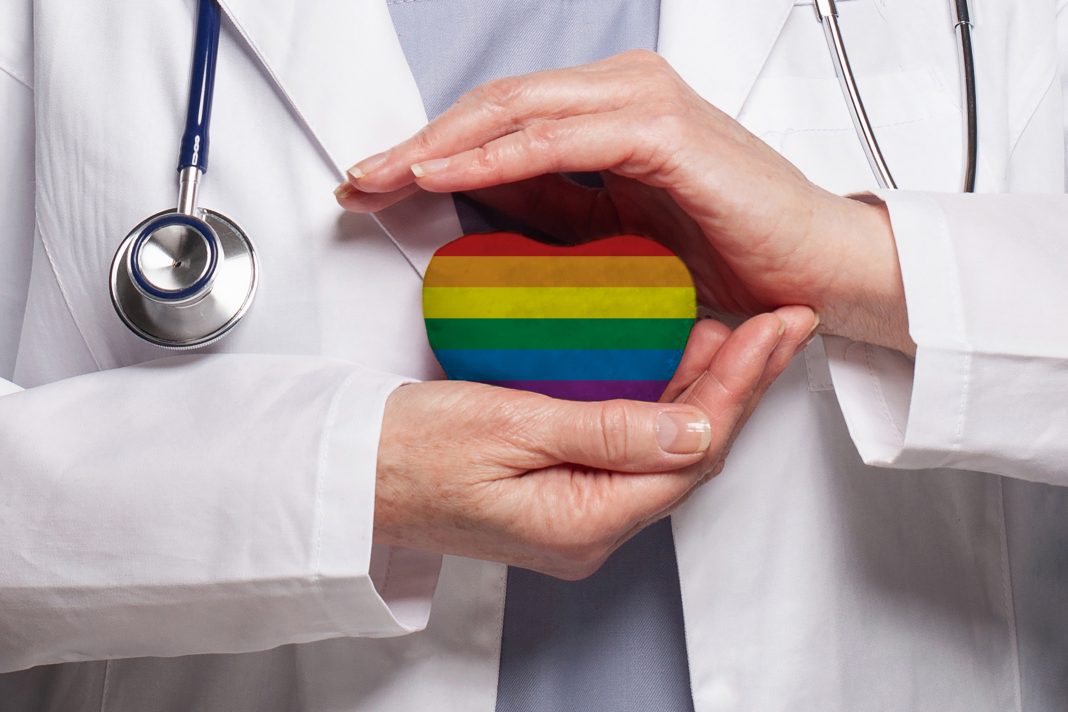 A New Mexico clinic displays inclusive signage, representing the state’s role as a refuge for transgender patients seeking gender‑affirming care after restrictions in neighboring states.