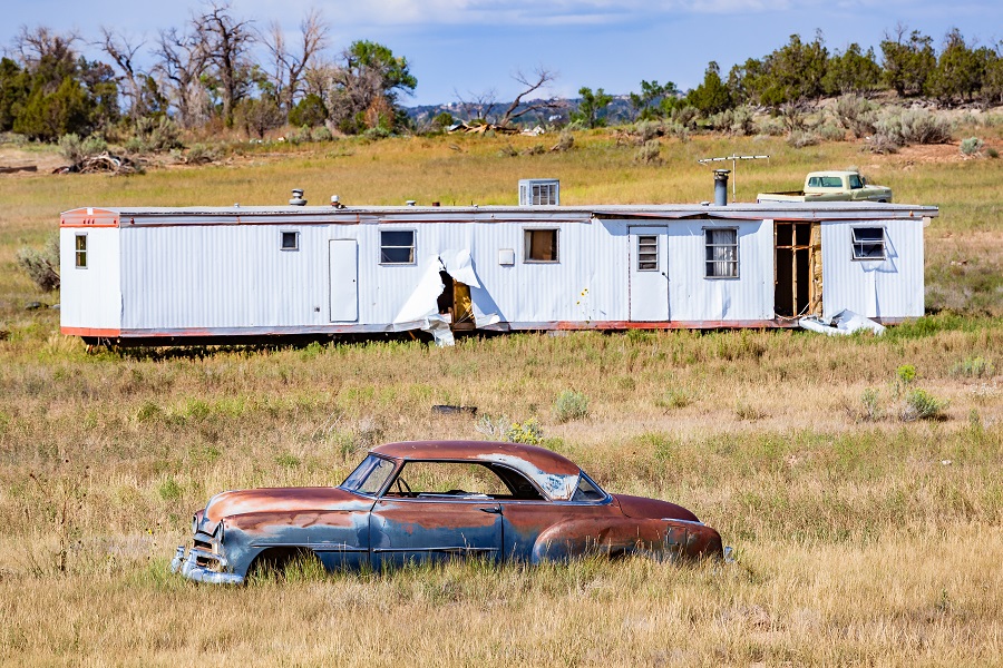 A wrecked car in a meadow.. Usa, New Mexico, Summer 2011