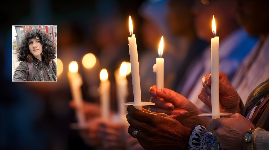 People holding lit candles in a peaceful gathering with a photo of Juniper Blessing.