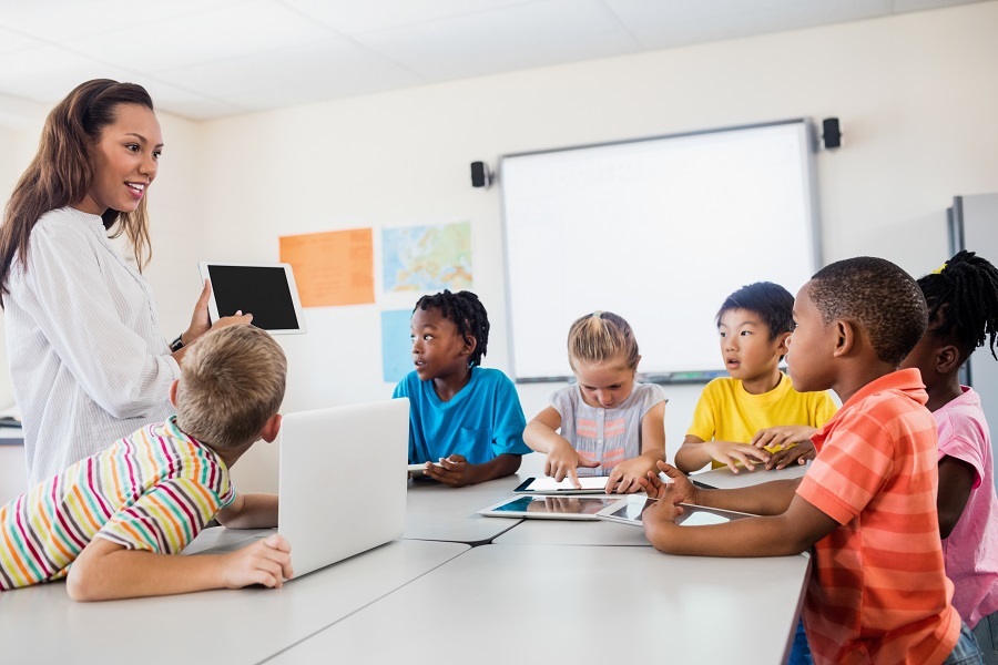A teacher giving lesson with new technology