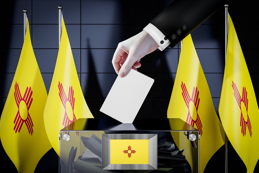 New Mexico flags, hand dropping ballot card into a box - voting, election concept - 3D illustration