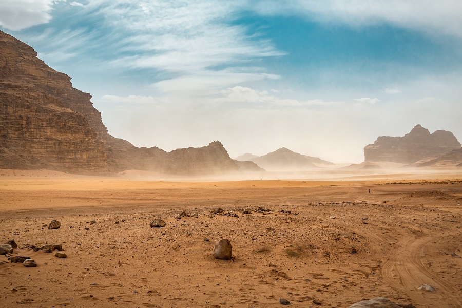The wind raises dust in the desert