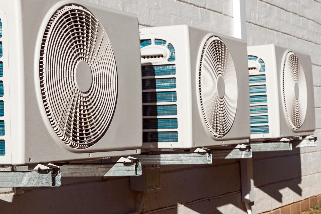 Visitors enter an Albuquerque multigenerational center experiencing air-conditioning issues during extreme summer heat.
