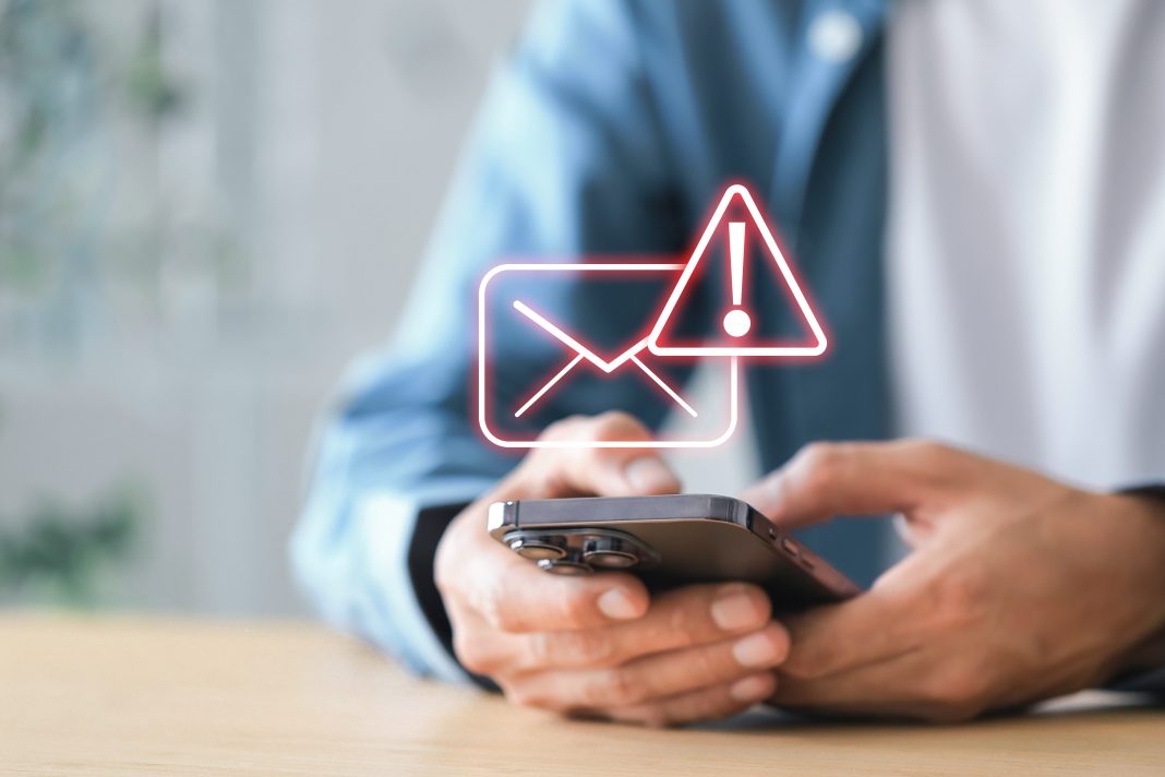 A smartphone displays a suspicious party invitation message that cybersecurity experts warn could be part of a phishing scam.