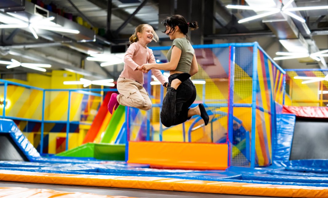 Children and families enjoy trampolines, climbing walls, and obstacle courses inside Urban Air Adventure Park in Albuquerque, highlighting its vibrant indoor attractions and family‑friendly atmosphere.