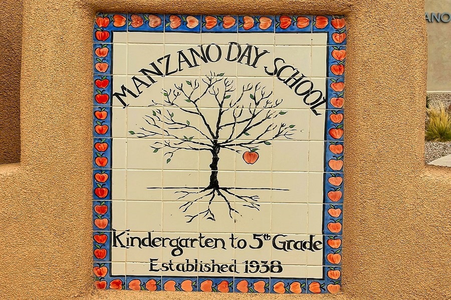 ALBUQUERQUE, NEW MEXICO, USA - March 10, 2023. Sign on yellow wall. Manzano Day School. Kindergarten to 5th grade. Founded in 1938.