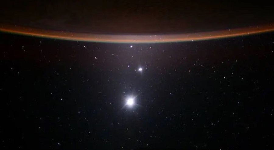 This image was captured by former astronaut Scott Kelly during his year aboard the International Space Station. From bottom to top we can spot Earth’s Moon, Venus, Jupiter and the crescent of Earth. NASA/Scott Kelly