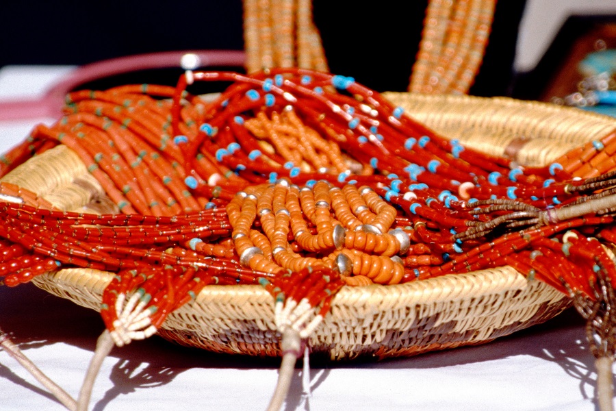 USA, New Mexico, Santa Fe: Annual Santa Fe Indian Market, Indian made coral & turquoise necklaces.