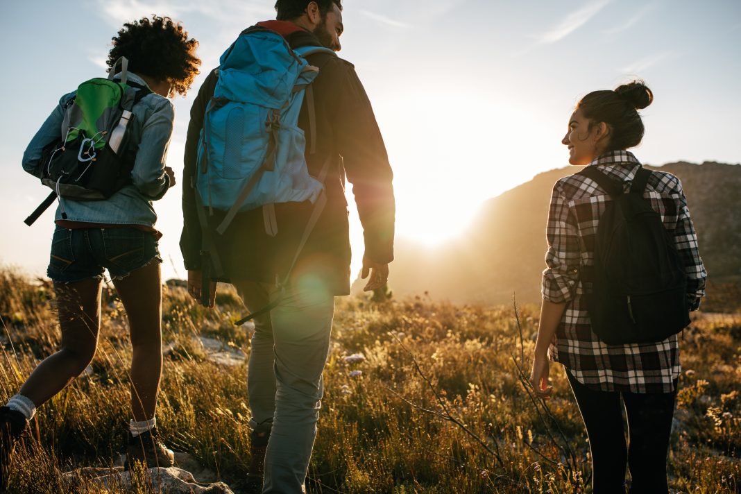 Hikers explore scenic mountains and outdoor trails in New Mexico, where visitors enjoy hiking, camping, fishing, and other outdoor adventures.