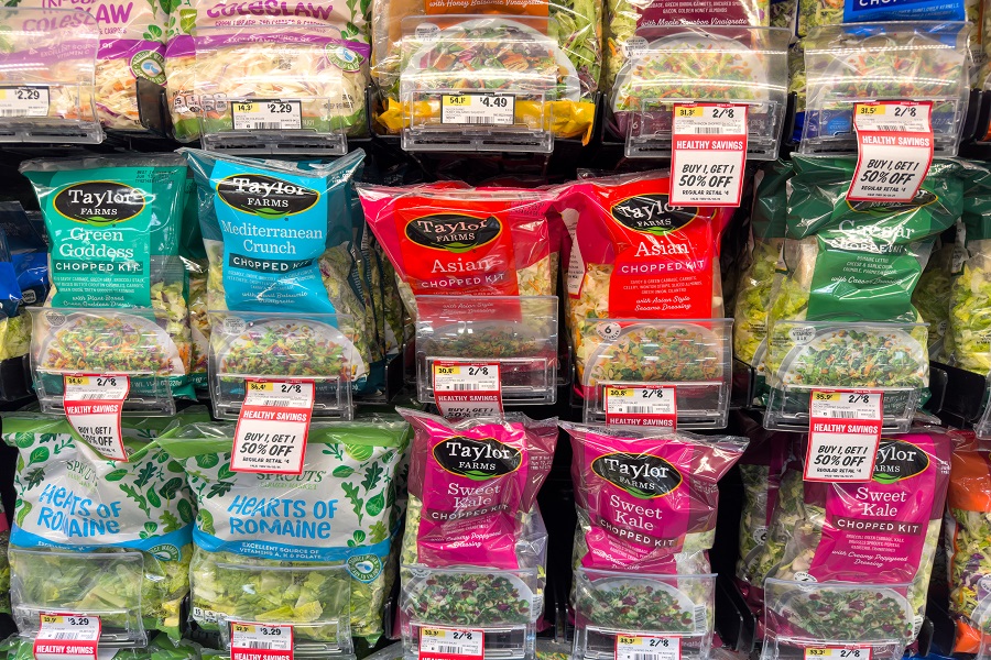 Variety of Taylor Farms Salad Kits in Grocery Store Produce Section