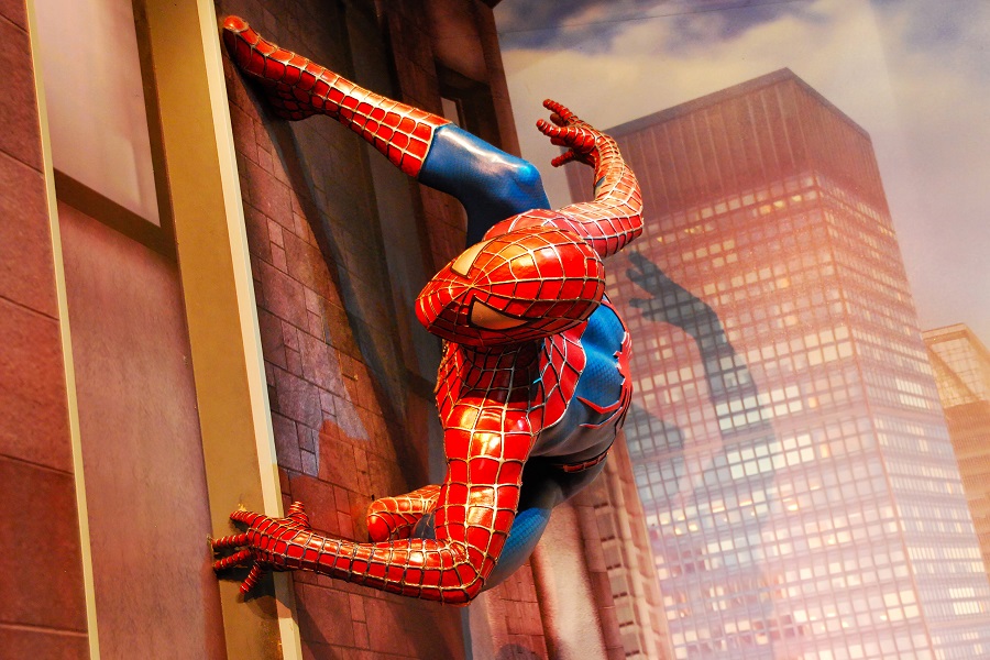 Amsterdam / Netherlands - August 8, 2015: Spider-man life size statue isolated on city buildings background