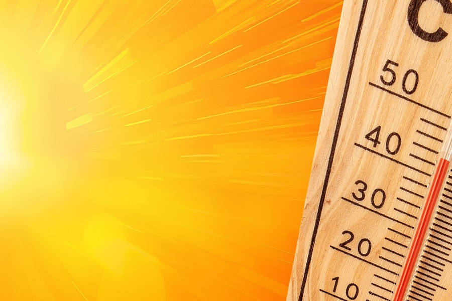Thermometer showing extreme high temperature on a hot sunny day