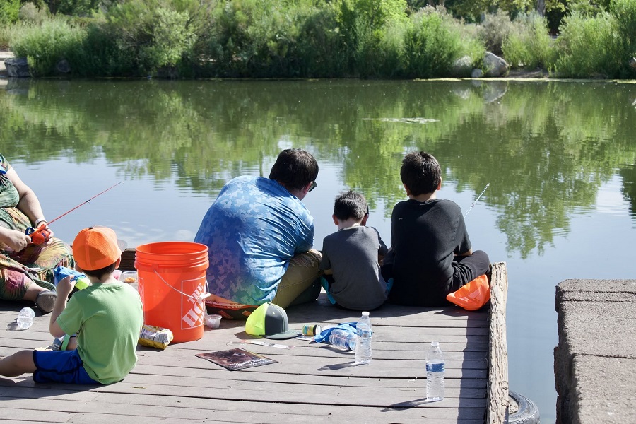 adult and children fishing
